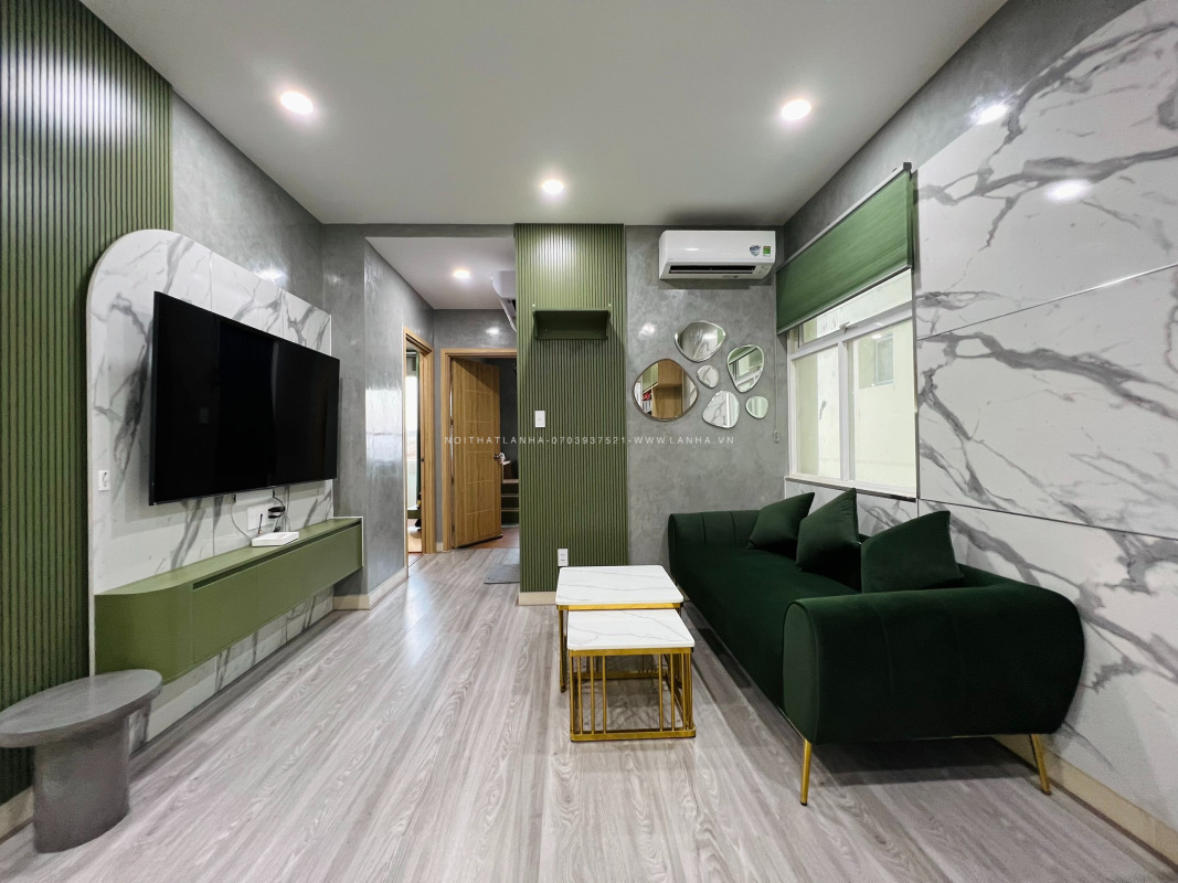 Mẫu thiết kế nội thất phòng khách màu xanh rêu kết hợp với vách giả vân đá