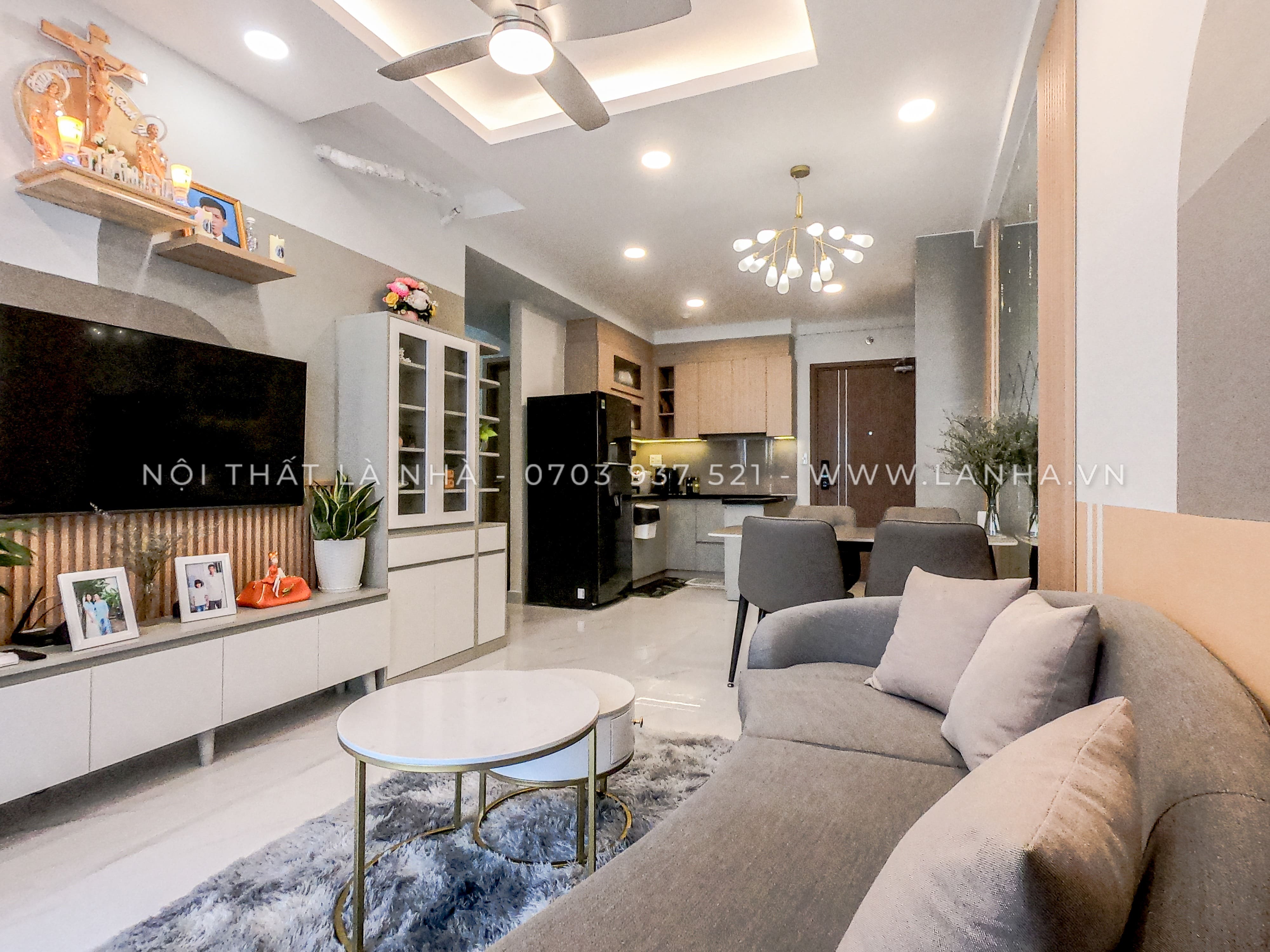Thiết kế phòng khách chung cư thông với phòng bếp