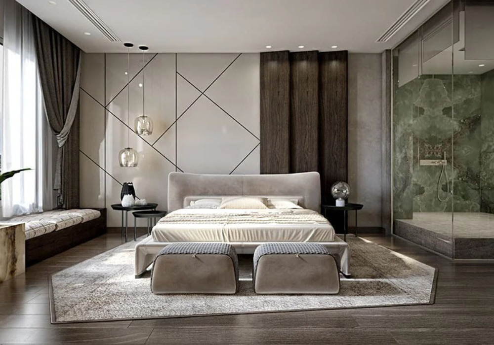 Một chiếc giường lớn với nệm êm ái và chăn mềm mại nằm ở trung tâm phòng, tạo nên trung tâm của không gian